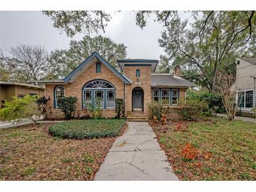 Brick home with a charming front porch and walkway at 1211 E Clifton St, Tampa, FL 33604