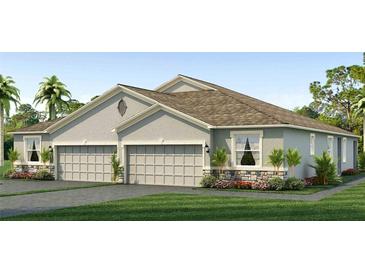 Two-story house with gray siding, two-car garage, and landscaping at 18134 Cropside Trl, Lakewood Ranch, FL 34211