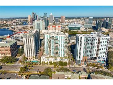 Aerial view of a luxury condo building with city skyline and amenities at 450 Knights Run Ave # 705, Tampa, FL 33602