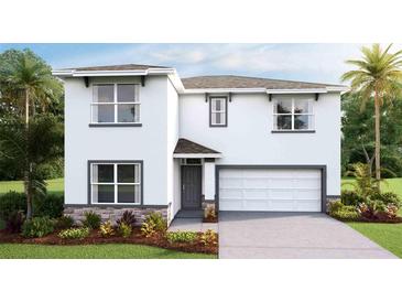 Two-story house with gray accents, stone detailing, and a two-car garage at 10588 Farm Hill Ave, Land O Lakes, FL 34638