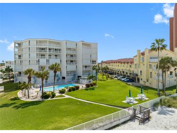 Aerial view of condo building with pool and oceanfront location at 17980 Gulf Blvd # 501, Redington Shores, FL 33708