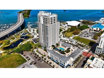 Aerial view of a modern highrise building with pool and waterfront access at 331 Cleveland St # 1102, Clearwater, FL 33755