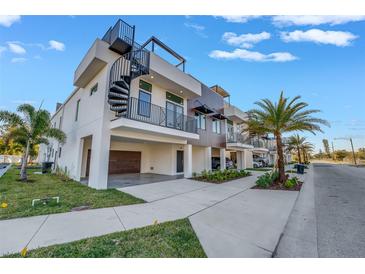 Modern 3 story home with spiral staircase and attached garage at 484 87Th Avenue North, St Petersburg, FL 33702