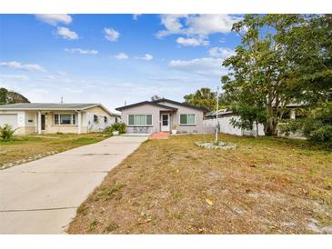 Updated bungalow with driveway, landscaping, and fenced yard at 4535 33Rd N Ave, St Petersburg, FL 33713