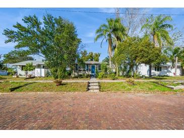 Cute bungalow with a charming front porch and landscaped yard at 5053 3Rd N Ave, St Petersburg, FL 33710