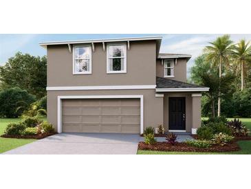 Two-story house with neutral color, two-car garage, and landscaped front yard at 5241 Salt Marsh Rd, Wimauma, FL 33598