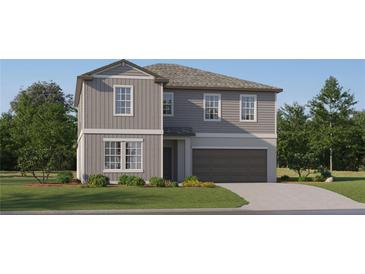 Two-story house with gray siding, a brown garage door, and landscaping at 12227 Radiant Gem Trl, Parrish, FL 34219