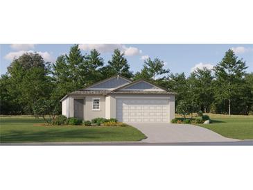 Single-story home with a two-car garage and landscaped lawn at 17548 Shirewood Way, Land O Lakes, FL 34638