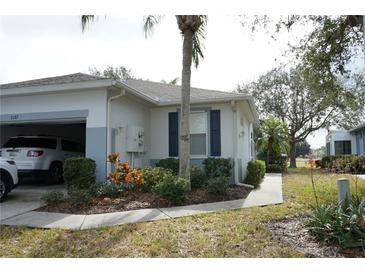 Well-maintained villa with attached garage and landscaped grounds at 2182 Acadia Greens Dr # 66, Sun City Center, FL 33573