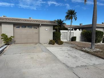 Attached garage with driveway and landscaped grounds at 439 Boca Ciega Point N Blvd, St Petersburg, FL 33708