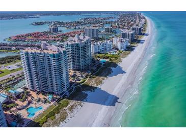 Aerial view of beachfront condo building with pool and ocean views at 1540 Gulf Blvd # 2004, Clearwater, FL 33767