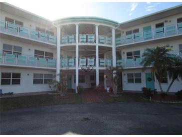 Building exterior featuring a mid-century modern design with teal accents at 1950 59Th N Ave # 110, St Petersburg, FL 33714