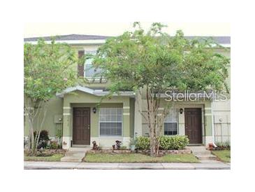 Inviting two-story townhome with landscaping and a charming facade at 20414 Berrywood Ln, Tampa, FL 33647