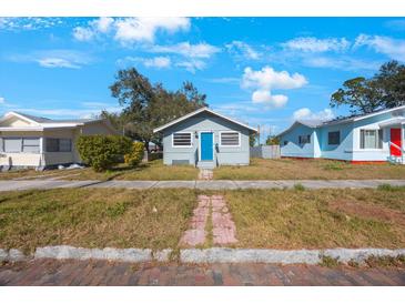 Cute bungalow style home with blue door at 4135 4Th N Ave, St Petersburg, FL 33713