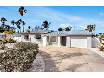 Newly renovated Florida home with metal roof and tropical landscaping at 2740 E Vina Del Mar Blvd, St Pete Beach, FL 33706