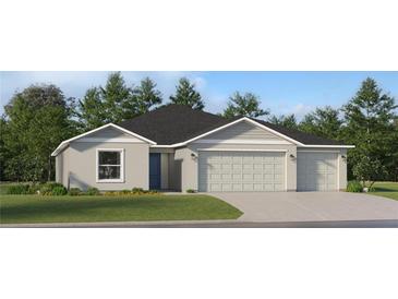 Two-story house with a three-car garage and a well-manicured lawn at 10264 Alder Green Dr, Riverview, FL 33578