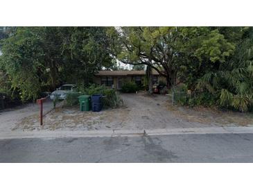 Charming single-story home featuring mature trees and a spacious front yard at 3416 N 48Th St, Tampa, FL 33605