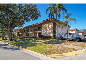 Well-maintained condo building with ample parking and landscaping at 1320 Moreland Dr # 20, Clearwater, FL 33764