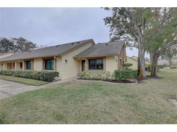 Attractive exterior of a single-story home with well-manicured landscaping at 2579 Bay Berry Dr # 42D, Clearwater, FL 33763