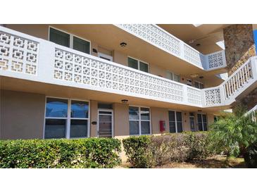 Exterior view of condo building with balconies and landscaping at 4915 Bay Ne St # 335, St Petersburg, FL 33703