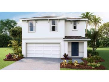 Two-story house featuring a white exterior, two-car garage, and landscaping at 5247 Salt Marsh Rd, Wimauma, FL 33598