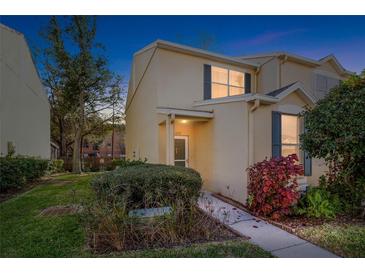 Inviting two-story townhome with landscaping and a walkway at 6333 Osprey Lake Cir, Riverview, FL 33578