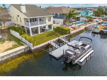 Aerial view of waterfront home with private dock and boat at 4207 Des Prez Ct, Hernando Beach, FL 34607
