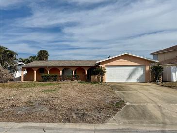 Single story home with a large yard at 6437 1St Palm Pt, St Pete Beach, FL 33706