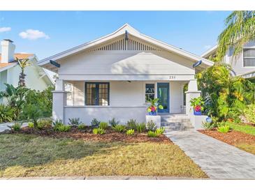 Charming bungalow with landscaped yard and brick walkway at 235 11Th Ne Ave, St Petersburg, FL 33701