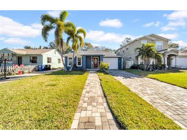 Cute bungalow style home with a brick paver driveway and well-manicured lawn at 3621 19Th Street N, St Petersburg, FL 33713