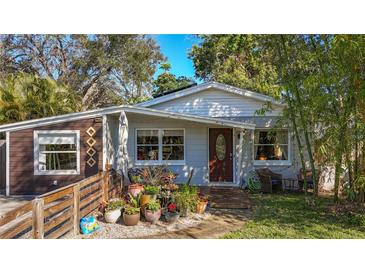 Charming bungalow with colorful landscaping and a welcoming front porch at 2606 46Th S St, Gulfport, FL 33711