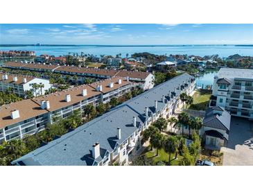 Aerial view of waterfront community with boats and resort-style amenities at 443 Pinellas Bayway S # 105, Tierra Verde, FL 33715