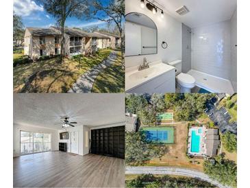 Condo building with screened balconies and a walkway at 12218 Fox Chase Dr # G2, Hudson, FL 34669