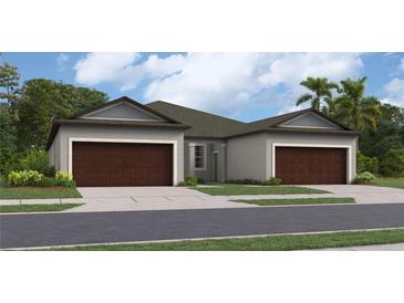 Two-story house with brown doors and gray siding at 12641 Lily Quartz Loop, Parrish, FL 34219