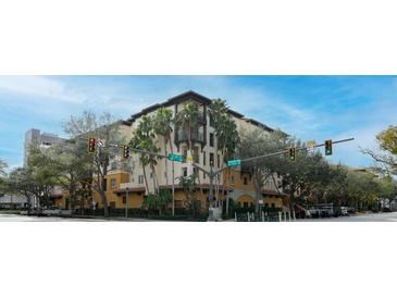 Building exterior showcasing Spanish-style architecture, lush landscaping, and a vibrant streetscape at 200 4Th S Ave # 139, St Petersburg, FL 33701