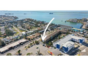 Aerial view showing condo building near waterfront at 460 Paula S Dr # 401, Dunedin, FL 34698