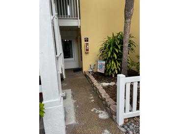 Inviting condo entryway with landscaping and walkway at 3540 42Nd S St # C, St Petersburg, FL 33711