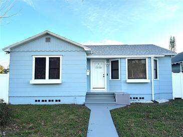 Charming light blue house with white trim, steps, and walkway at 2720 9Th N Ave, St Petersburg, FL 33713