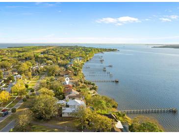 Aerial view of waterfront home with private dock and expansive water views at 316 Shore E Dr, Oldsmar, FL 34677