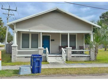 Tan Bungalow with front porch, and small yard at 2005 N 25Th St, Tampa, FL 33605