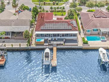 Waterfront home with private dock, solar panels, and spacious backyard at 1818 Dolphin S Blvd, St Petersburg, FL 33707