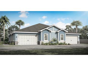 Two-story home with gray roof, blue siding, and a three-car garage at 2569 Mario Way, Clearwater, FL 33761