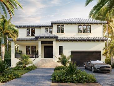 Two-story home with attached garage and landscaped yard at 408 Columbia Dr, Tampa, FL 33606