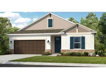 One-story home with brown garage door and blue shutters at 710 Sky Shade Dr, Apollo Beach, FL 33572