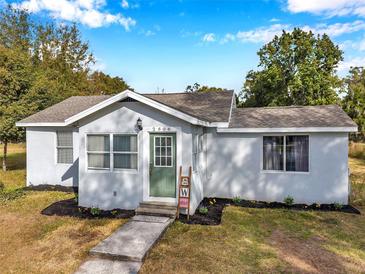 Charming one-story home with a green door and landscaped yard at 2606 S Wilder Loop, Plant City, FL 33565