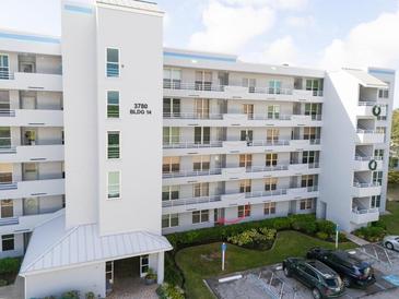 Condo building with parking and landscaping at 3780 Pinebrook Cir # 106, Bradenton, FL 34209