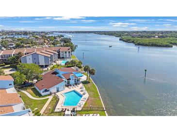 Community features waterfront access and a pool at 1 Windrush Blvd # 100, Indian Rocks Beach, FL 33785