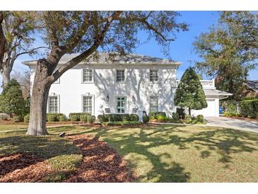 Beautiful two-story home with lush landscaping and a spacious driveway at 4811 Culbreath Isles Rd, Tampa, FL 33629