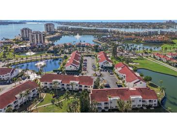 Aerial view of a waterfront community with lush landscaping and multiple buildings at 6085 Bahia Del Mar Blvd # 105, St Petersburg, FL 33715