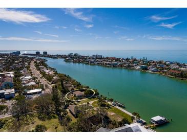 Aerial view of waterfront property with private dock at 9320 Gulf Blvd, St Pete Beach, FL 33706